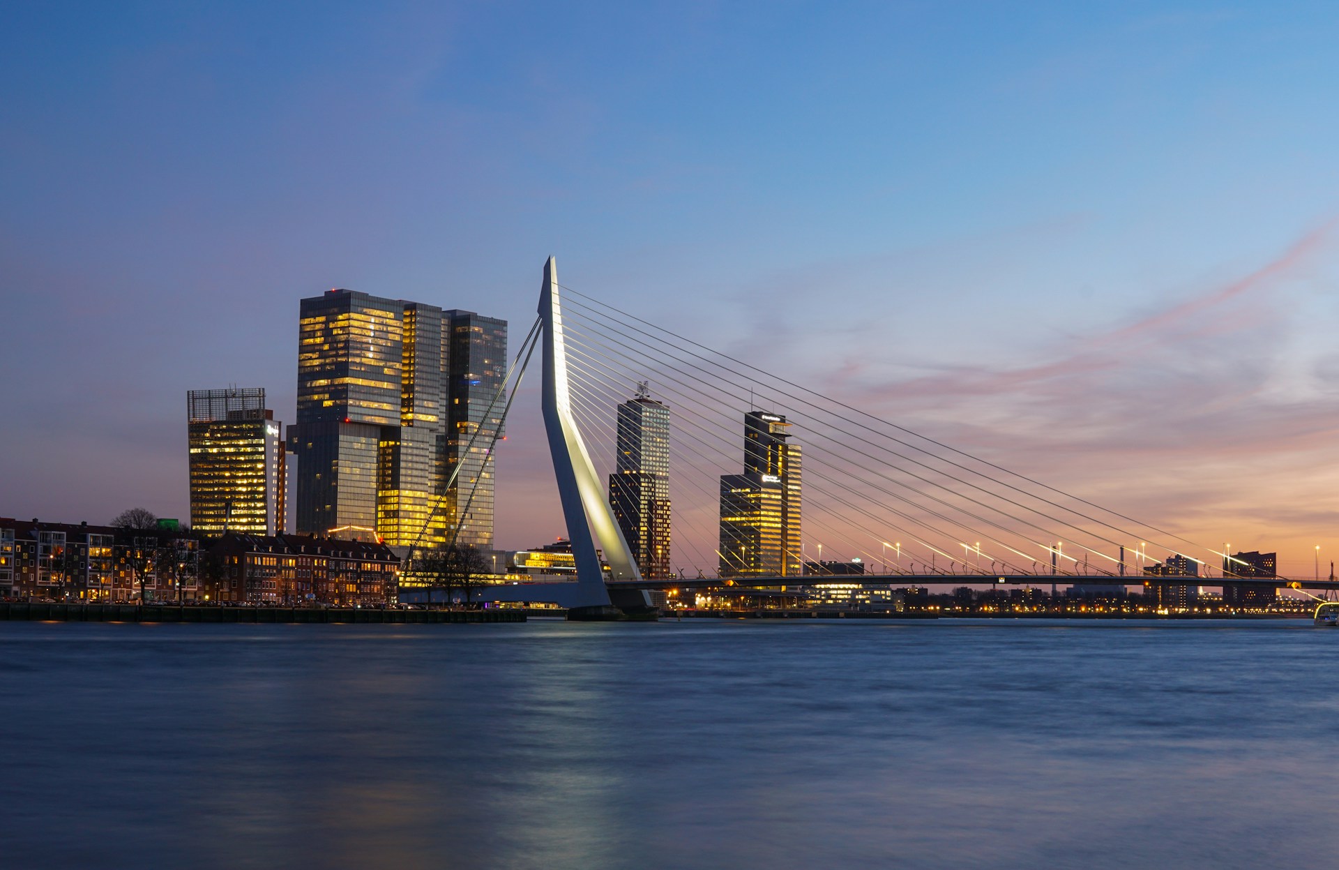 A Bridge with a city backdrop at dusk