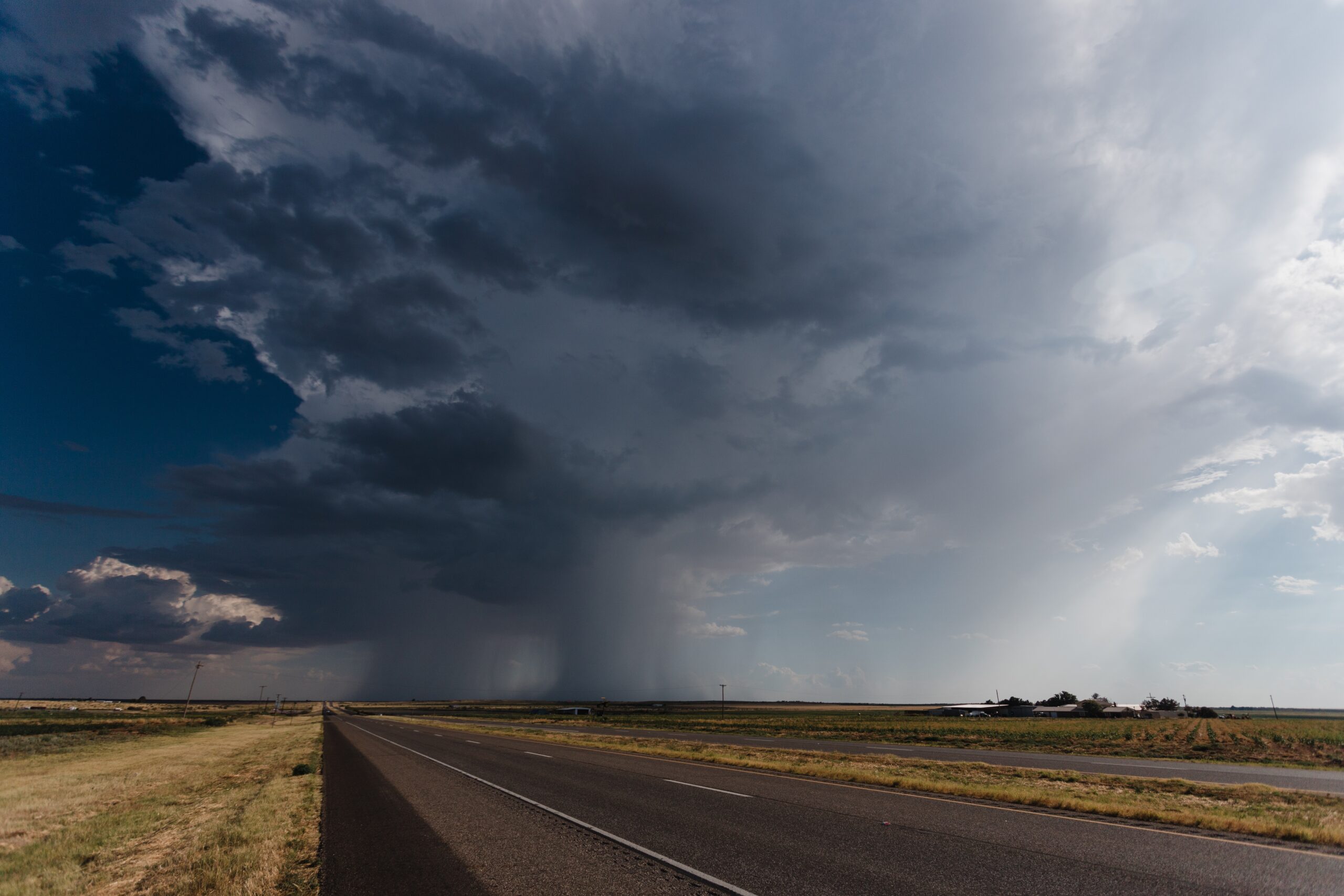 The long asphalt road under the cloudy rainy sky - Image